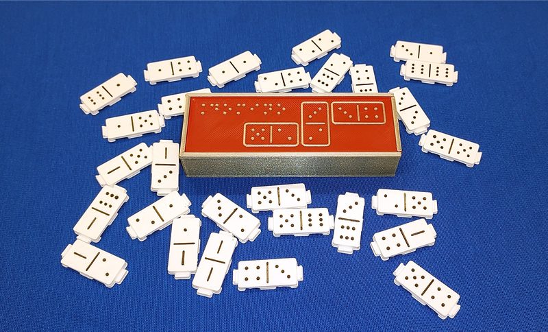 Domino z zaczepami i wypukłymi punktami.